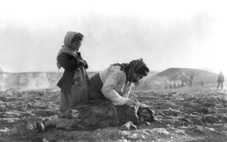 armenian_woman_kneeling_beside_dead_child_in_field